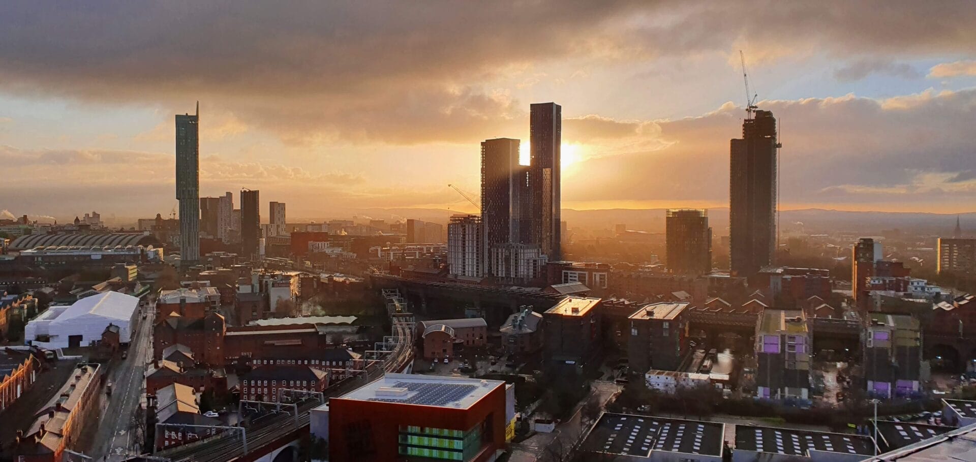 A cityscape at sunset, showcasing the beautiful architecture and urban landscape.