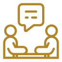 Industrial Abseiling Two people sitting at a table in Manchester, discussing rope access.